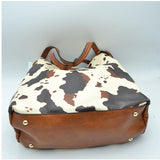 Cow print shoulder bag with tassel - brown