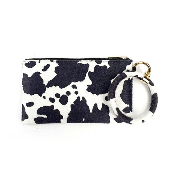 Faux-fur cow printed wristlet bag - black and white