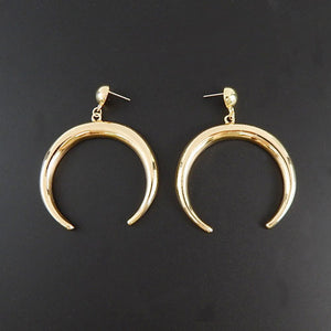 Gold crescent earring
